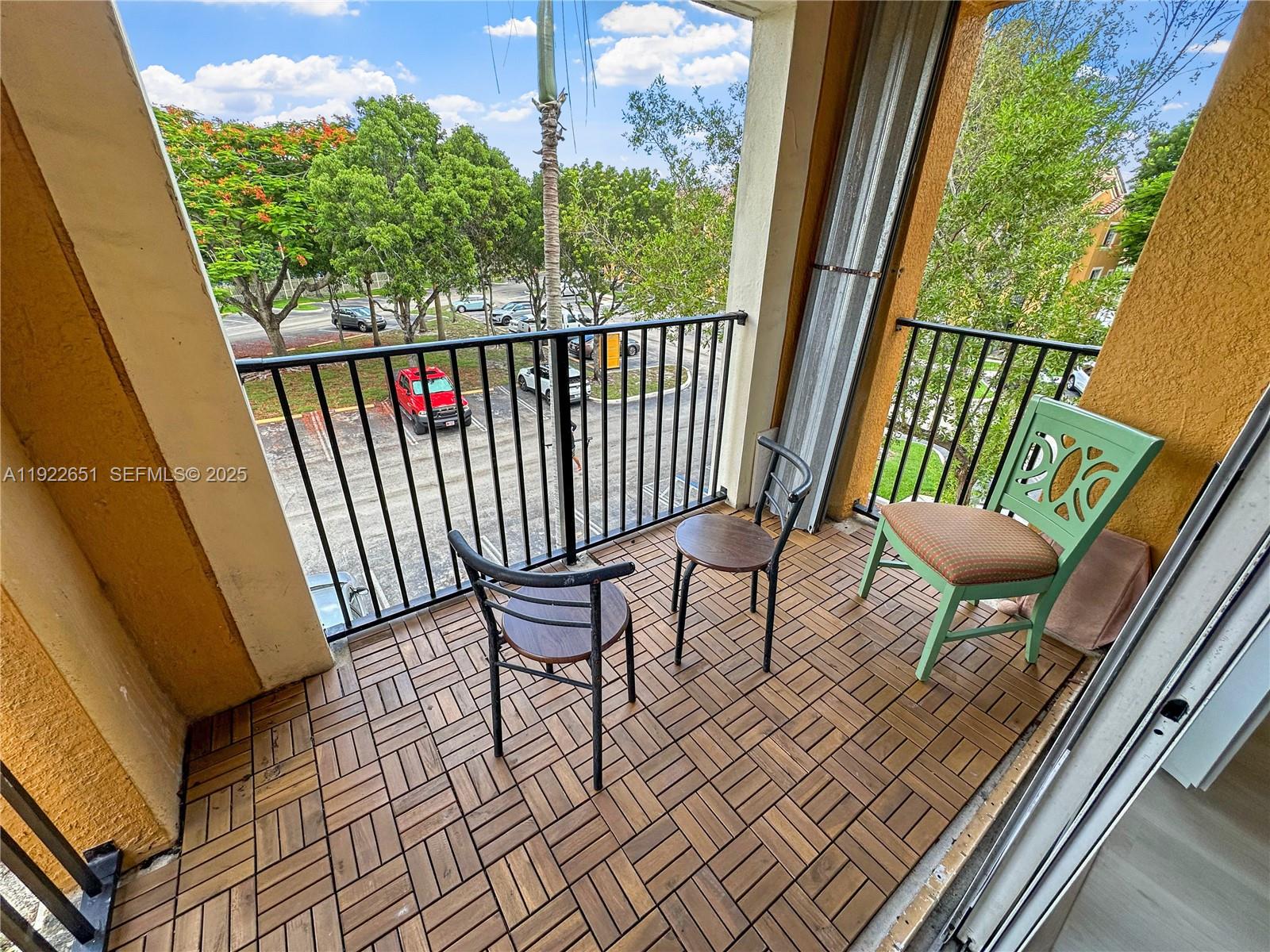 2120 West Preserve Way, Unit 301 Miramar, FL 33025 - Photo 6 of 28 a view of a chairs and table in the balcony