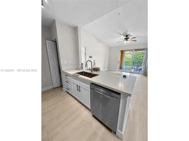 a kitchen with a sink and a window