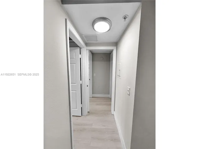 a view of a hallway with closet