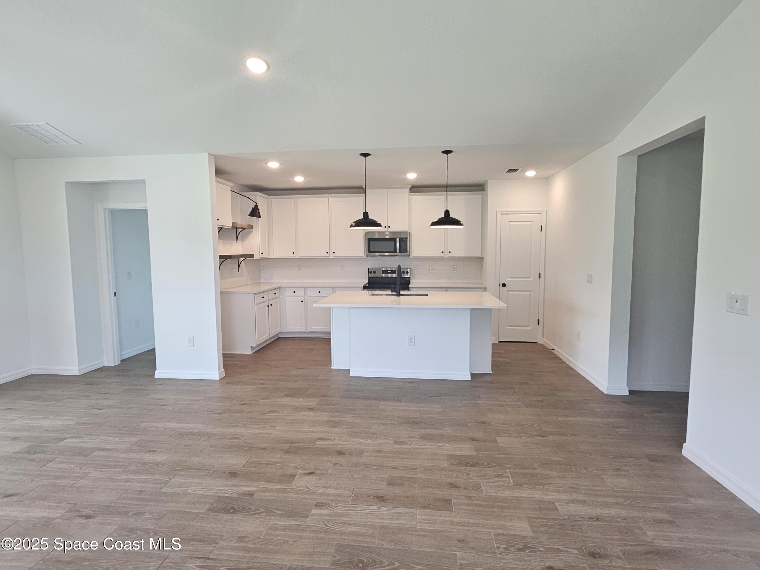 318 Olin Road Palm Bay, FL 32908 - Photo 2 of 17 Kitchen & great room