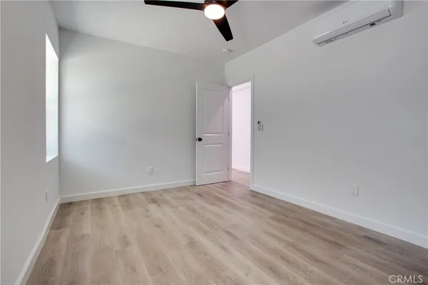 a view of a storage and utility room with washer and dryer