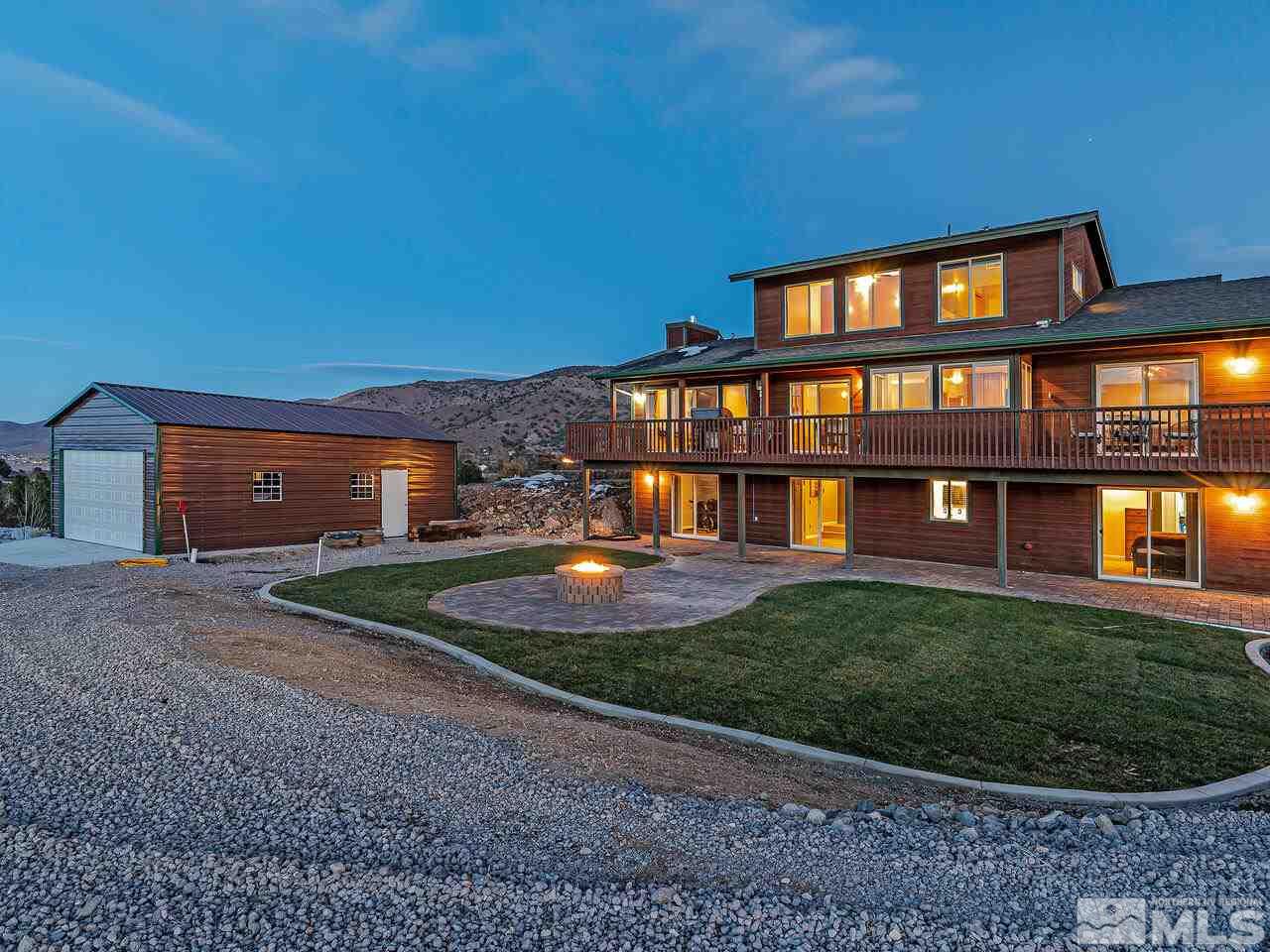 14300 Sitting Bull Circle Reno, NV 89521 - Photo 3 of 32 a front view of a house with a yard