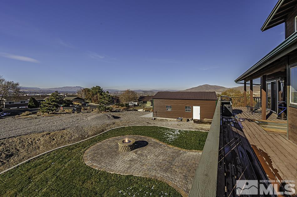 14300 Sitting Bull Circle Reno, NV 89521 - Photo 8 of 32 a view of a terrace with wooden floor and city view