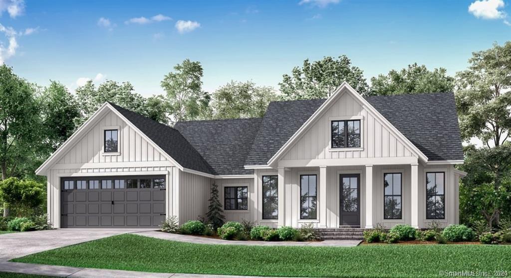 408-1 Scotland Road Norwich, CT 06360 - Photo 1 of 1 a front view of a house with a yard and garage