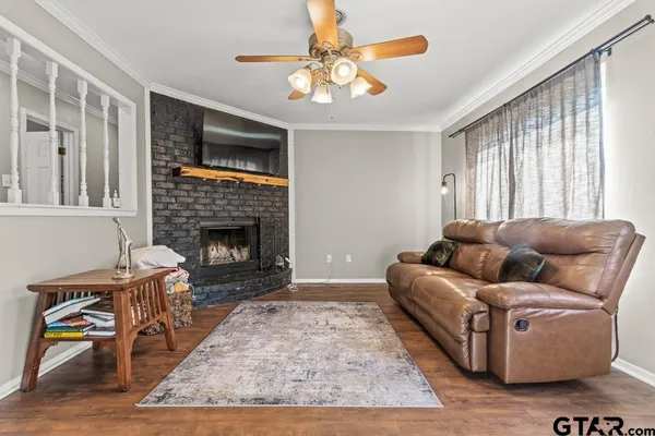 a spacious bedroom with a bed and a flat screen tv