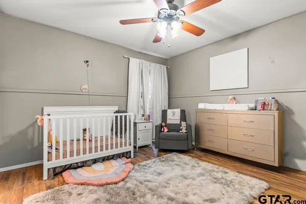 a kitchen with white cabinets sink and stainless steel appliances