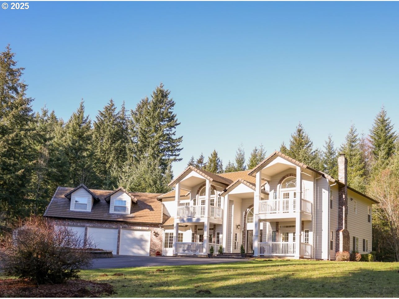5812 Northeast Livingston Road Camas, WA 98607 - Photo 1 of 27 a front view of a house with a big yard and potted plants