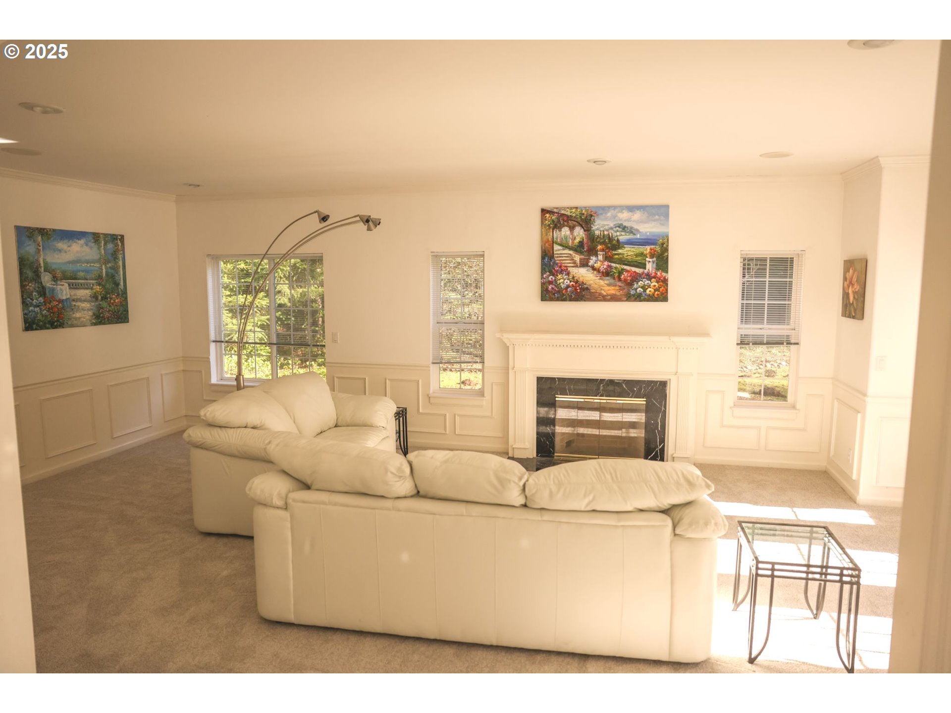 5812 Northeast Livingston Road Camas, WA 98607 - Photo 12 of 27 a living room with furniture a fireplace and a large window