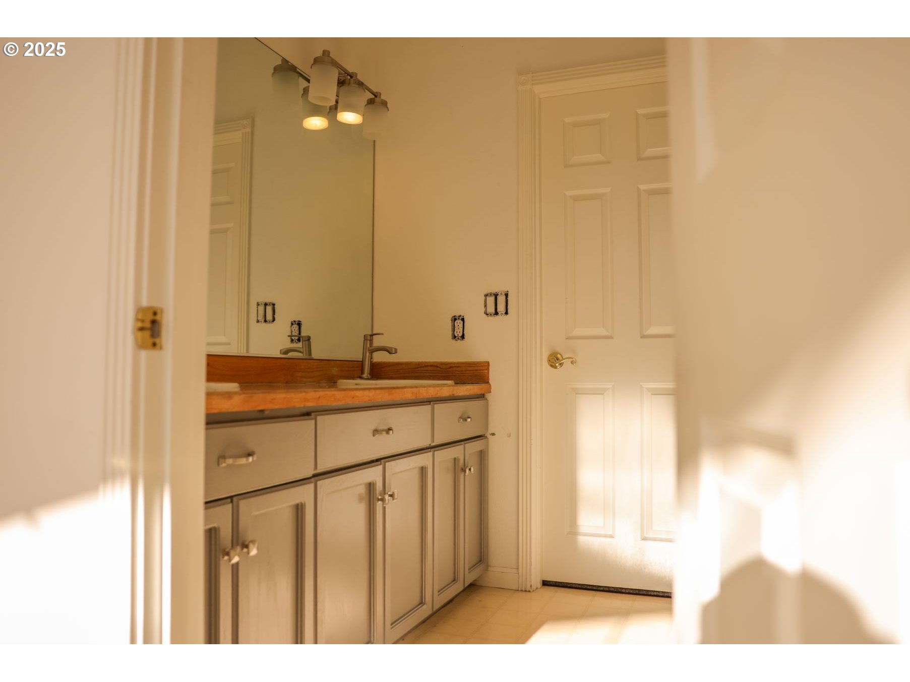 5812 Northeast Livingston Road Camas, WA 98607 - Photo 22 of 27 a bathroom with a sink a mirror and a shower