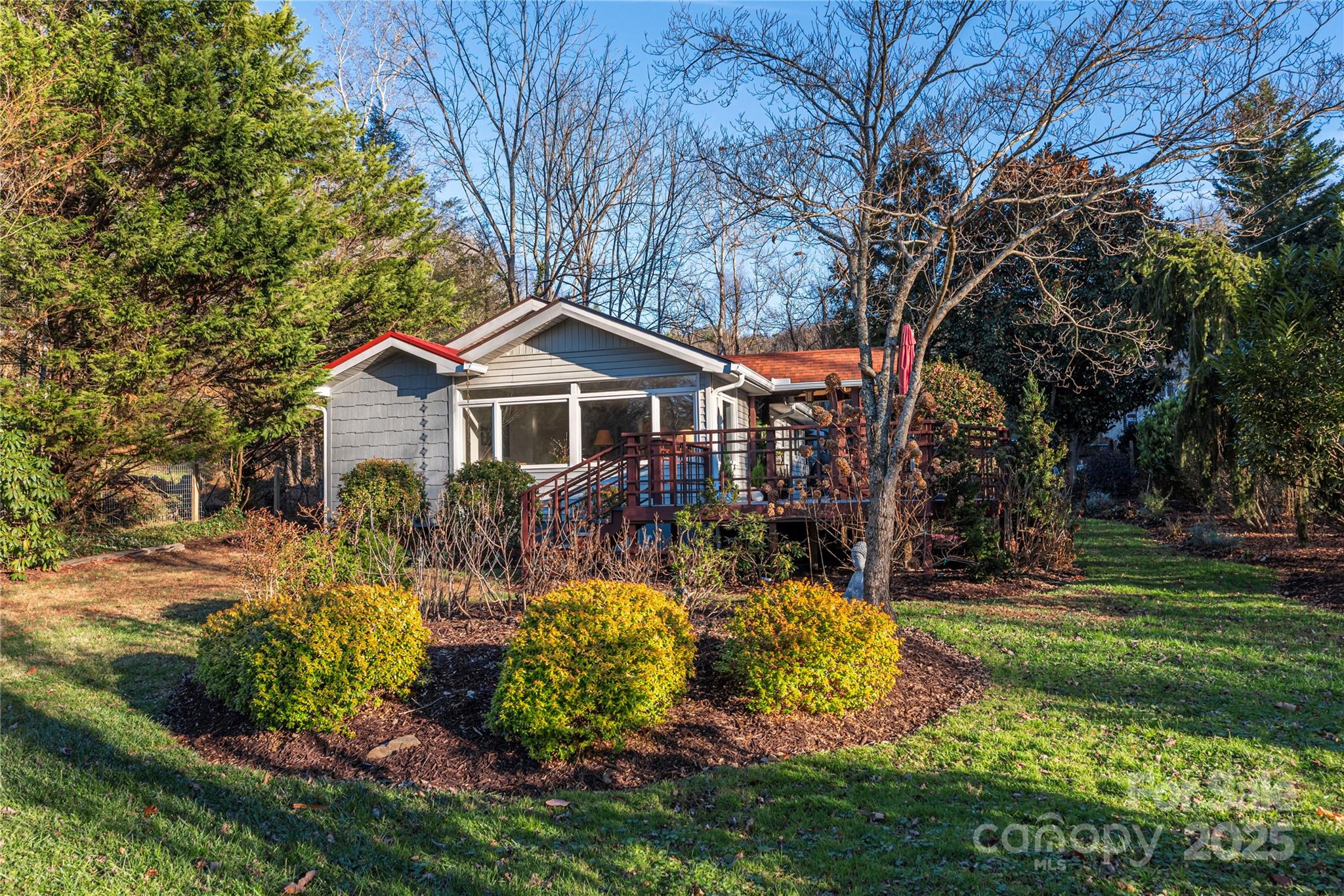 106 Spooks Branch Road Asheville, NC 28804 - Photo 1 of 28 a front view of a house with a yard table and chairs