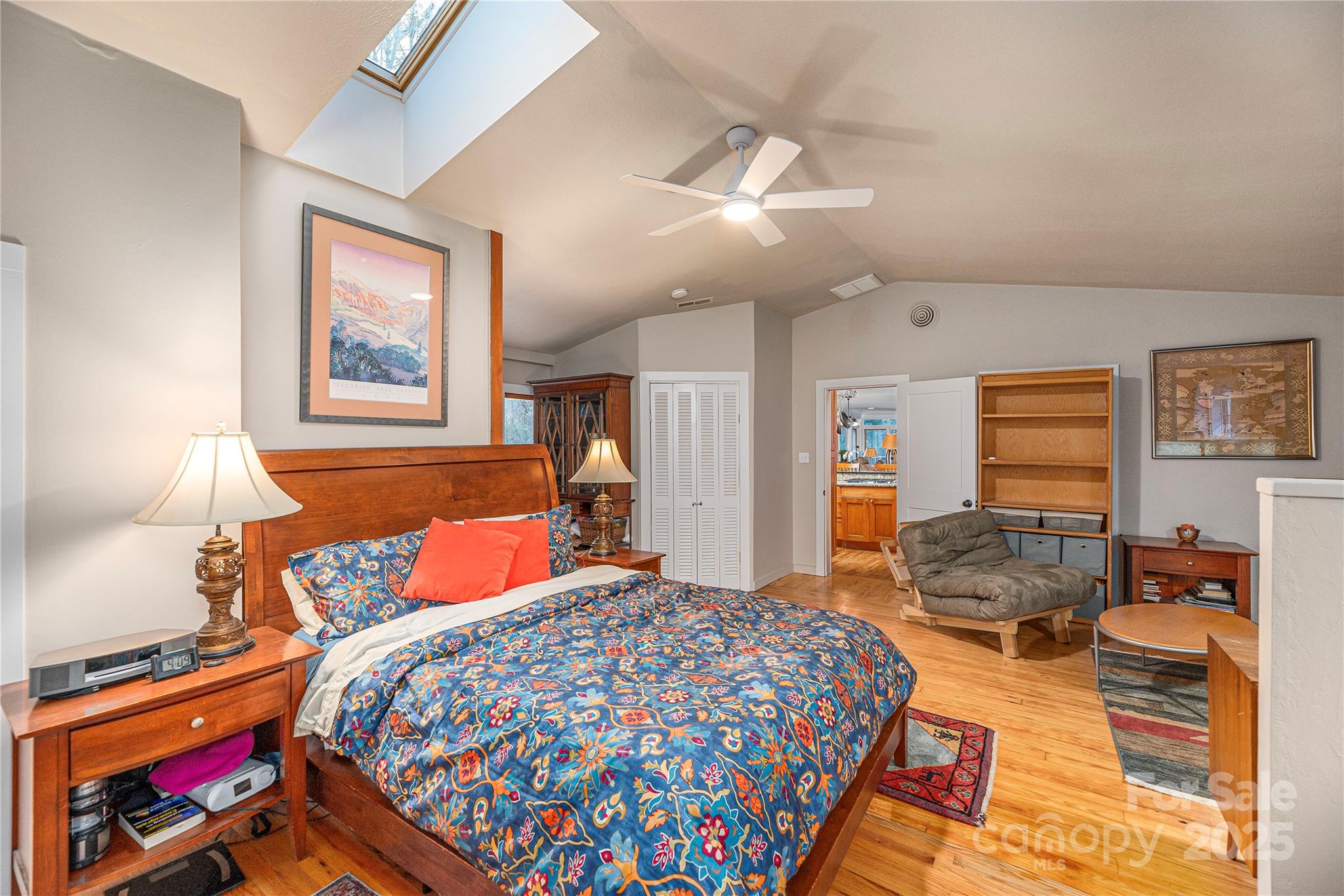 106 Spooks Branch Road Asheville, NC 28804 - Photo 16 of 28 a bedroom with a bed and wooden floor