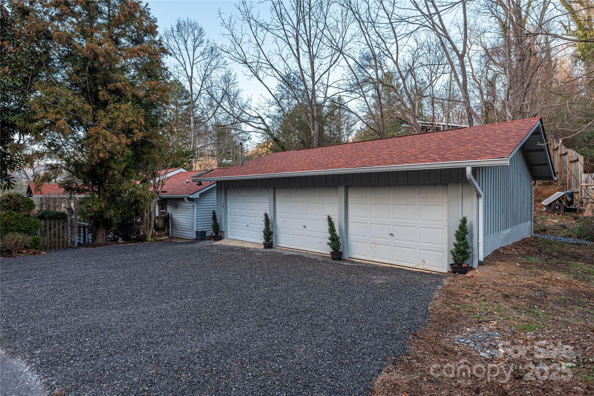 106 Spooks Branch Road Asheville, NC 28804 - Photo 25 of 28 a front view of a house with a yard and garage