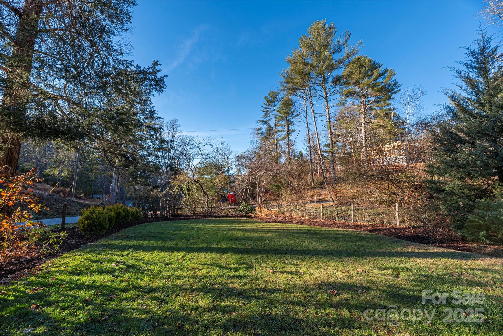 106 Spooks Branch Road Asheville, NC 28804 - Photo 28 of 28 a view of a golf course with a lake