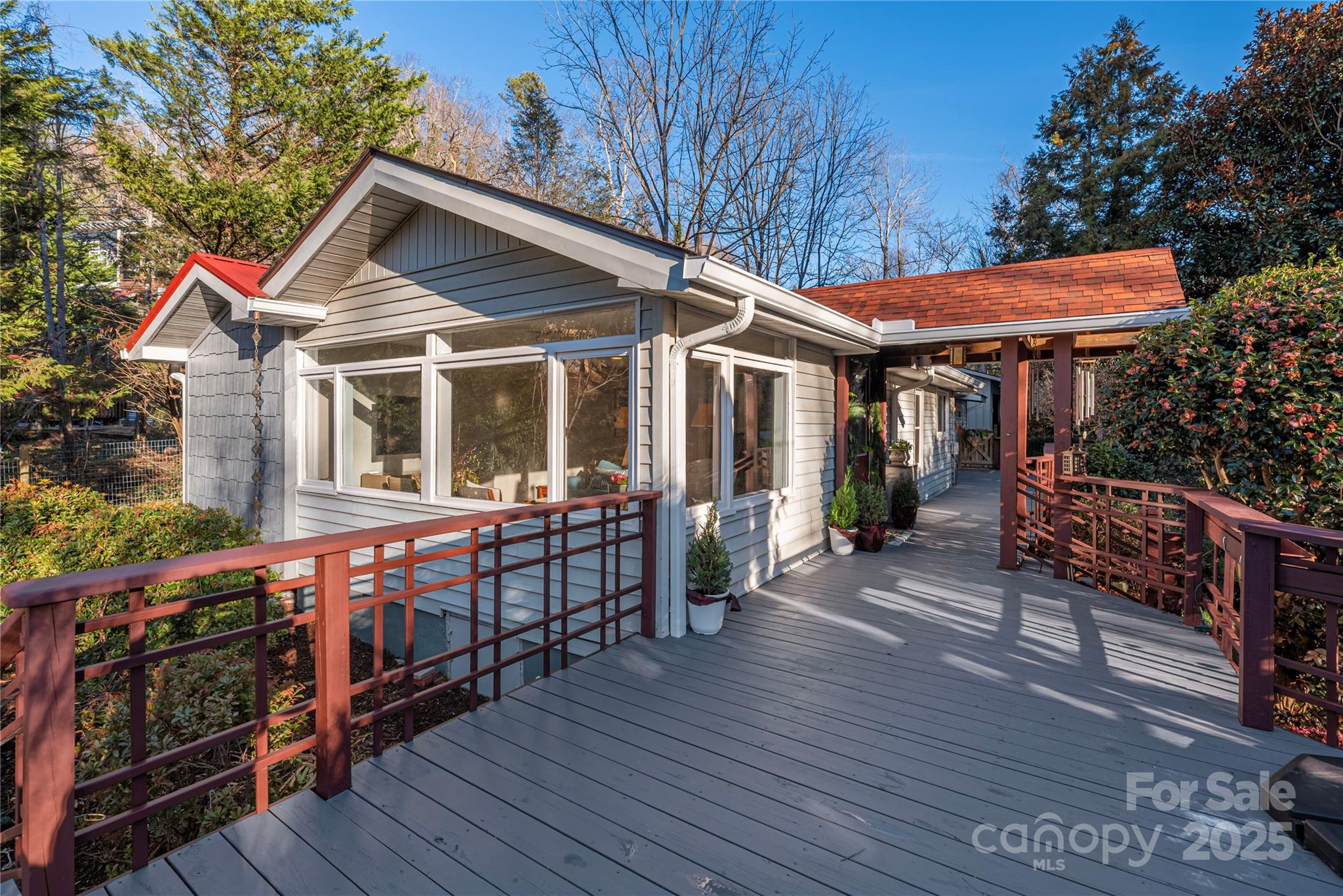 106 Spooks Branch Road Asheville, NC 28804 - Photo 4 of 28 a view of house with wooden floor and outdoor seating