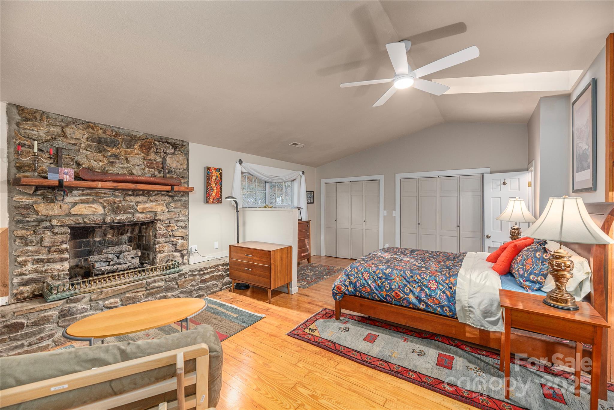 106 Spooks Branch Road Asheville, NC 28804 - Photo 6 of 28 a bedroom with a bed and a fireplace
