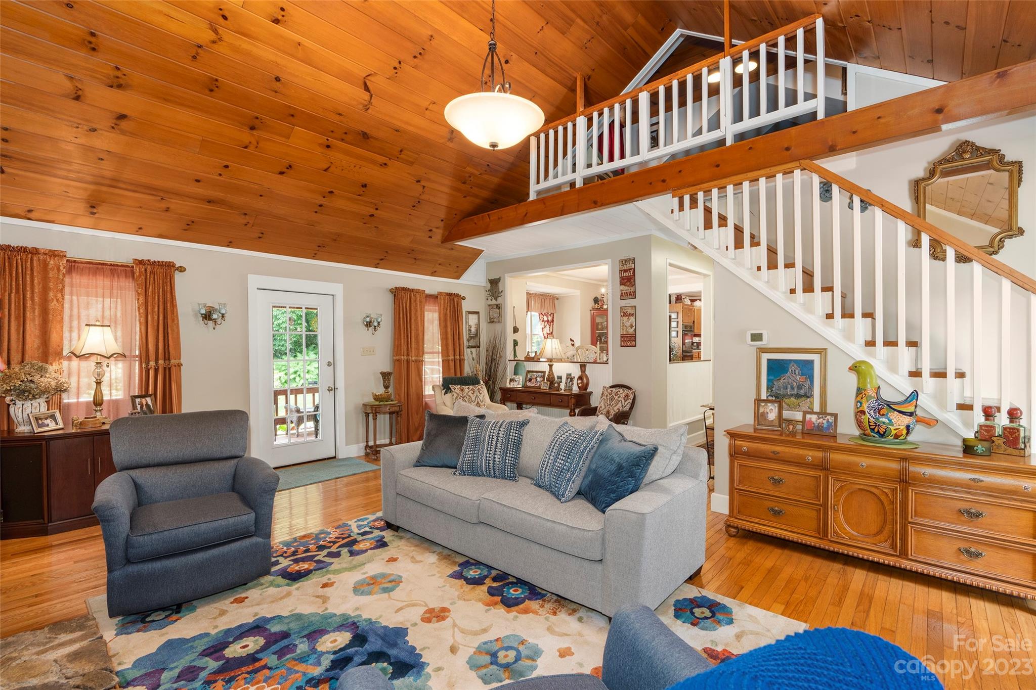 290 Last Mohican Trail Clyde, NC 28721 - Photo 11 of 46 a living room with furniture and a large window