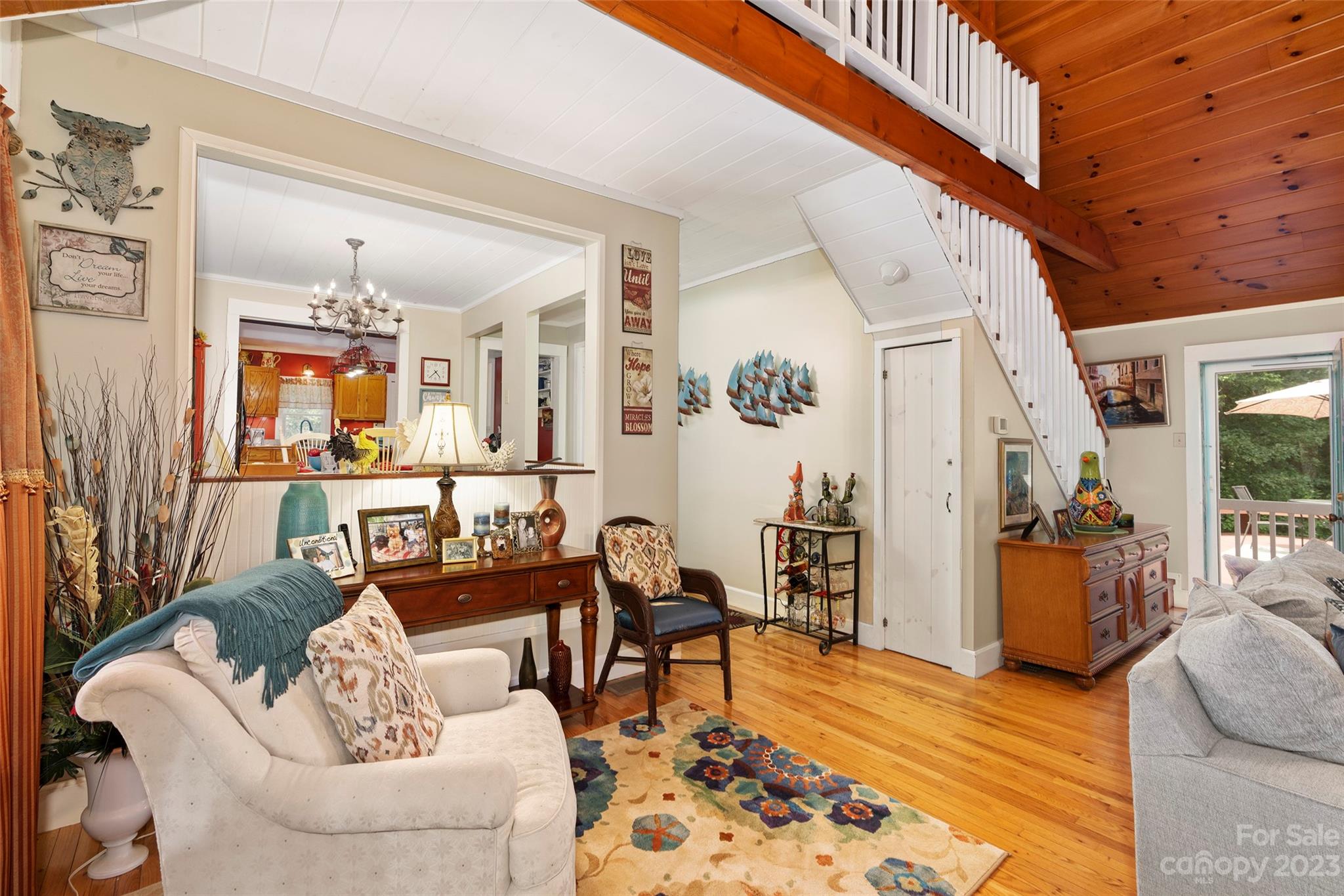 290 Last Mohican Trail Clyde, NC 28721 - Photo 12 of 46 a living room with furniture and wooden floor