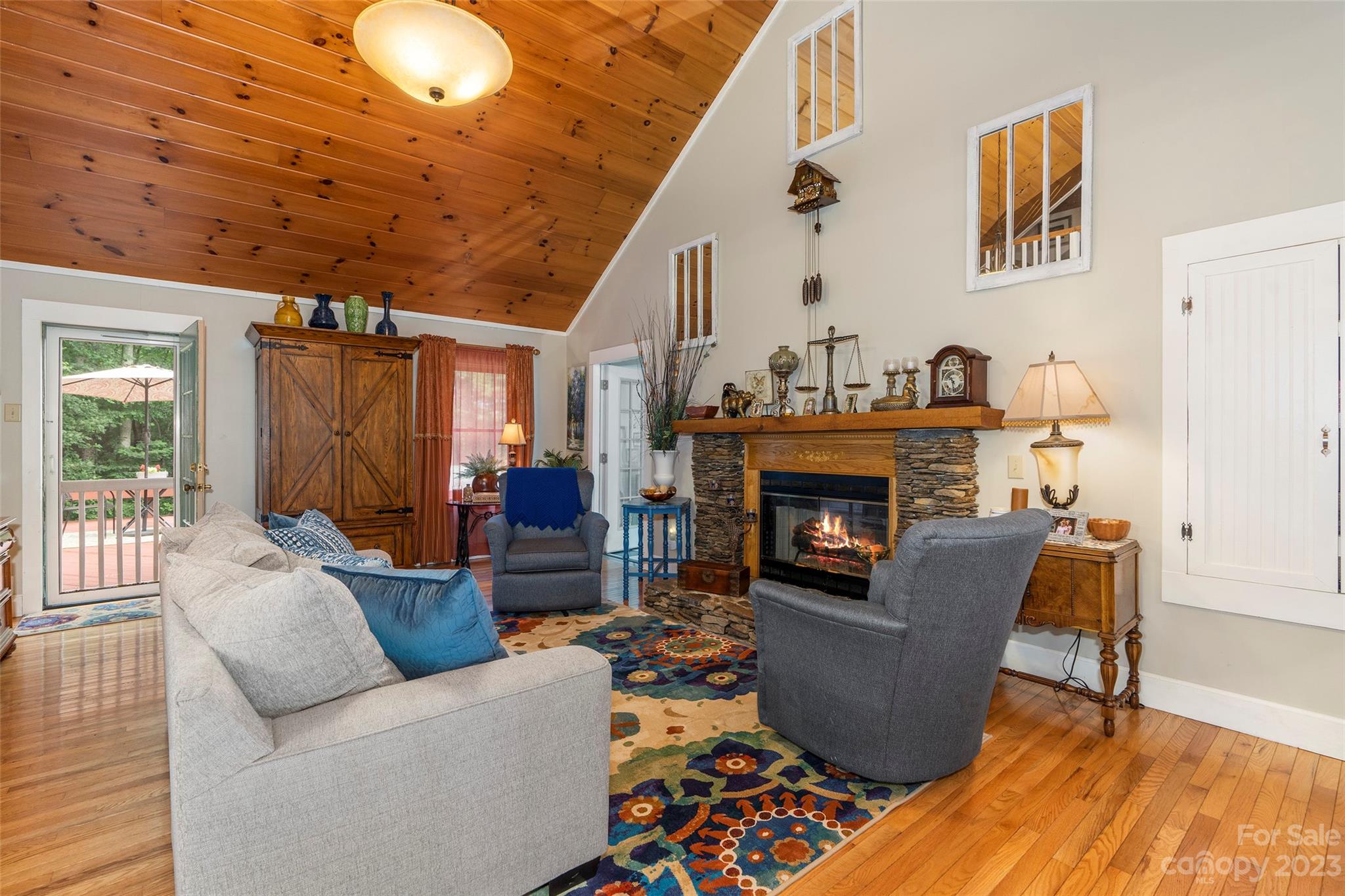 290 Last Mohican Trail Clyde, NC 28721 - Photo 13 of 46 a living room with furniture and a fireplace