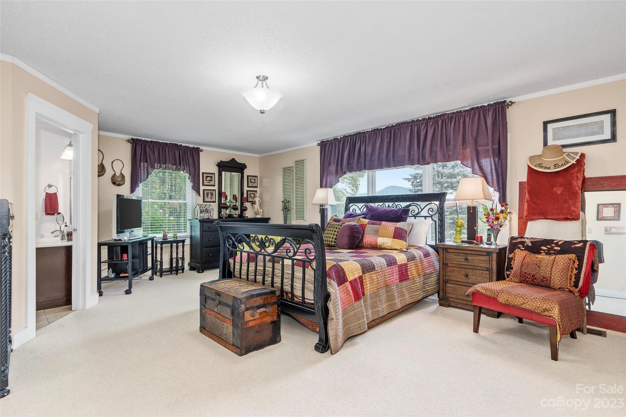 290 Last Mohican Trail Clyde, NC 28721 - Photo 21 of 46 a bedroom with furniture and a fireplace