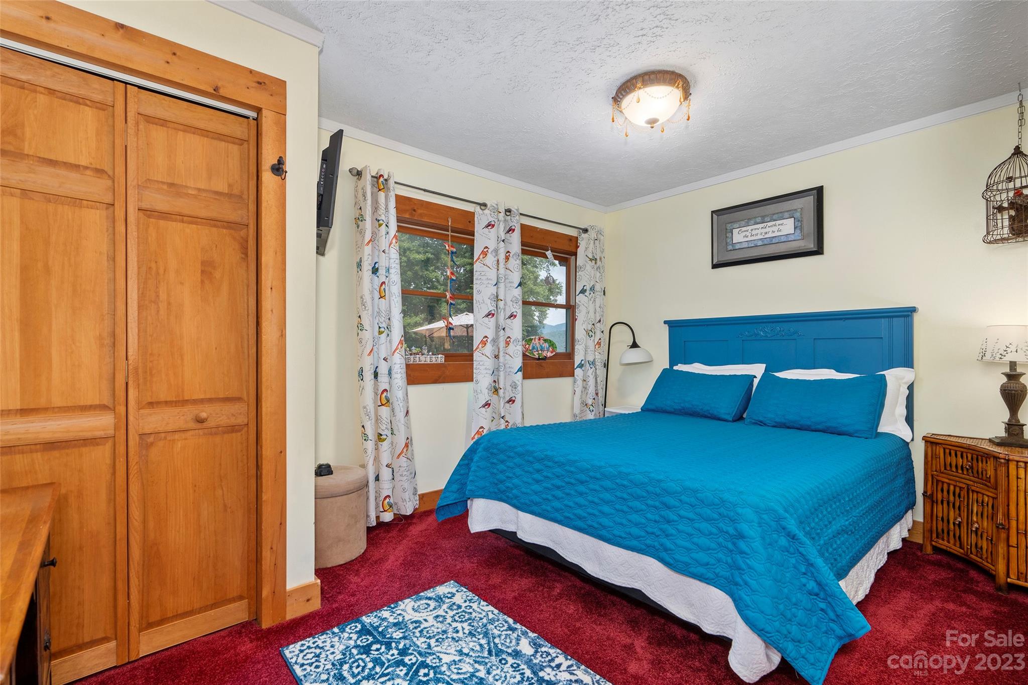 290 Last Mohican Trail Clyde, NC 28721 - Photo 26 of 46 a bedroom with a bed and a table