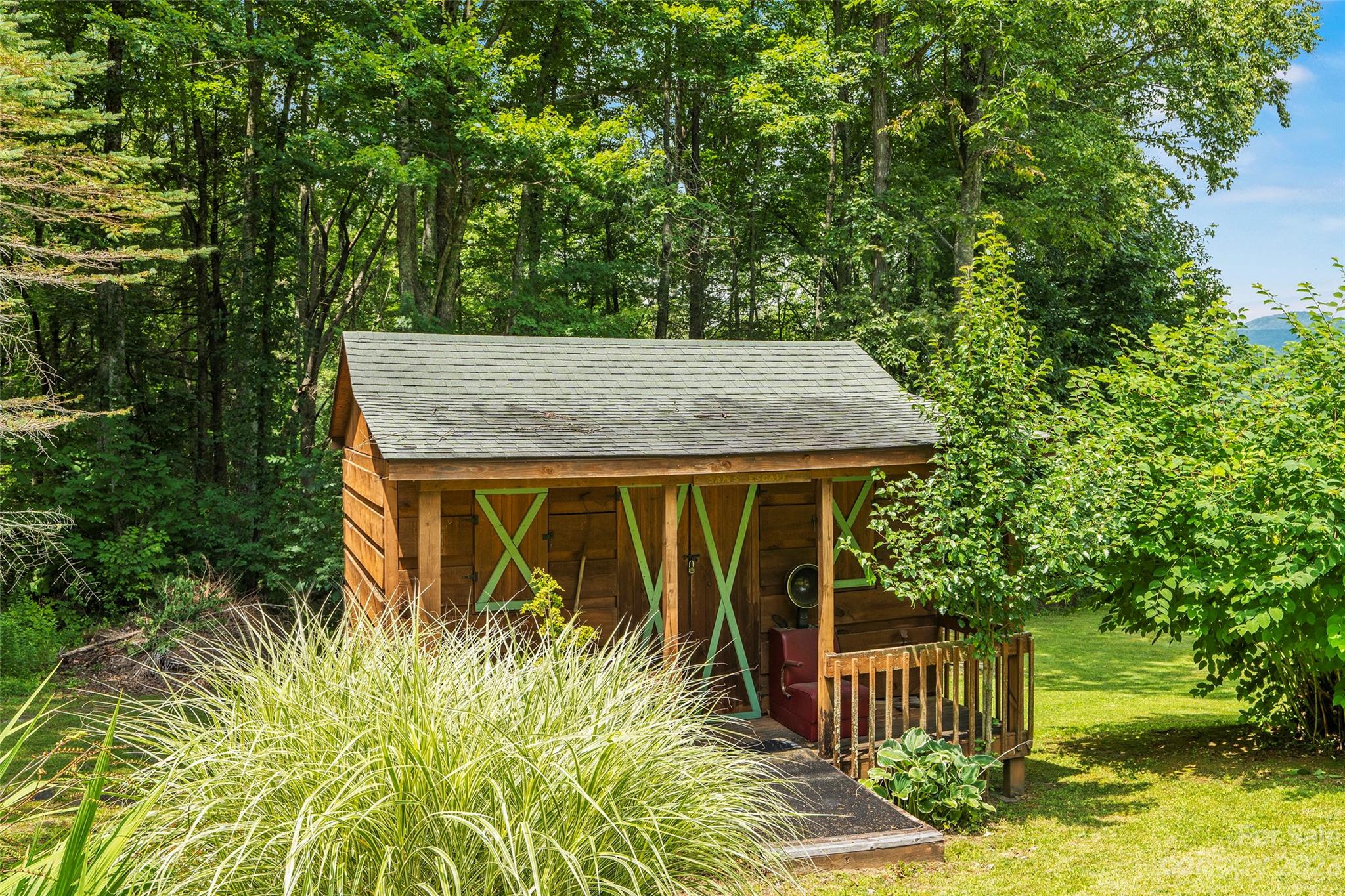 290 Last Mohican Trail Clyde, NC 28721 - Photo 37 of 46 a house with trees in front of it