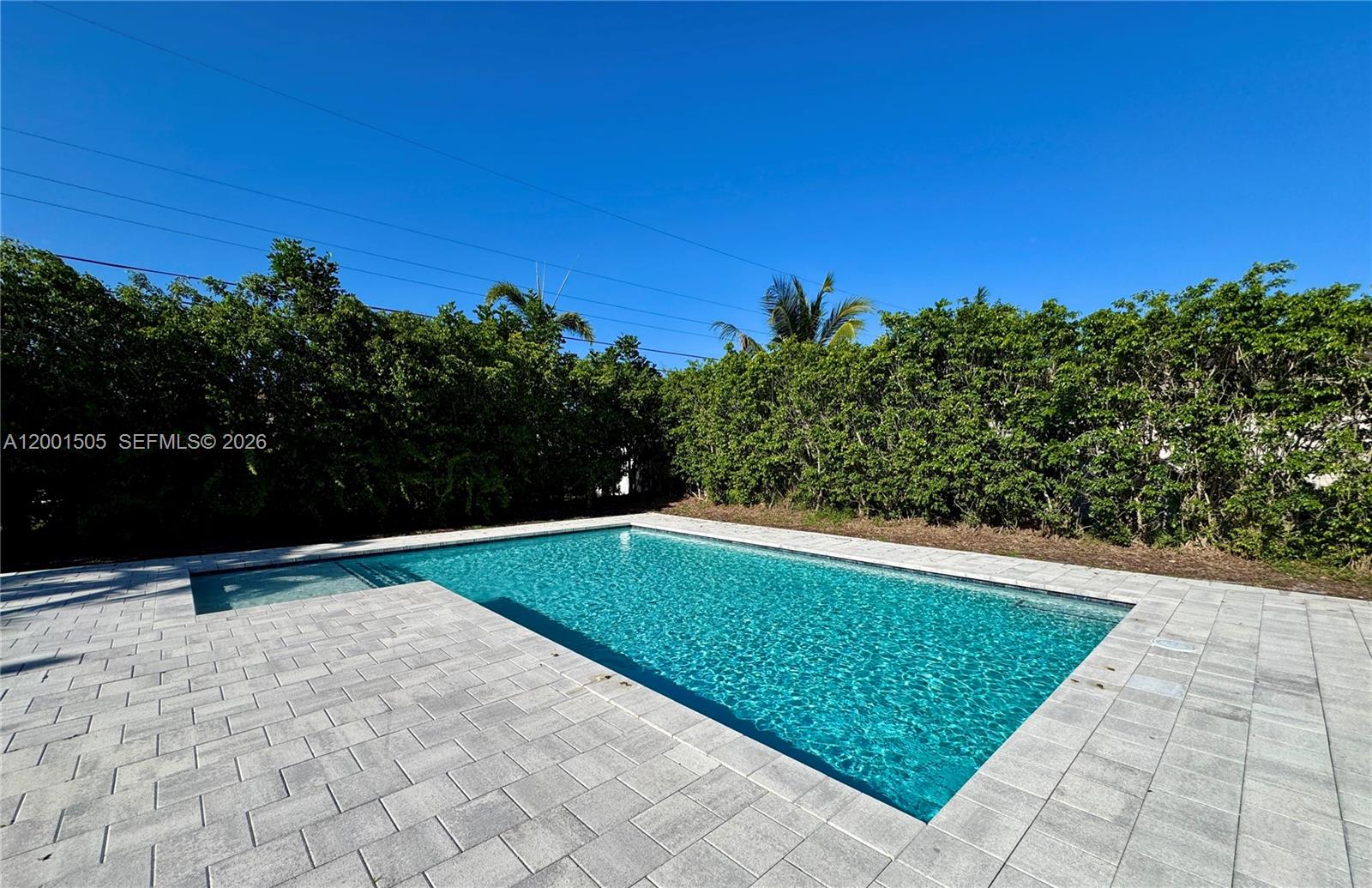 1093 Southwest 14th Street Boca Raton, FL 33486 - Photo 27 of 28 a view of swimming pool with a yard