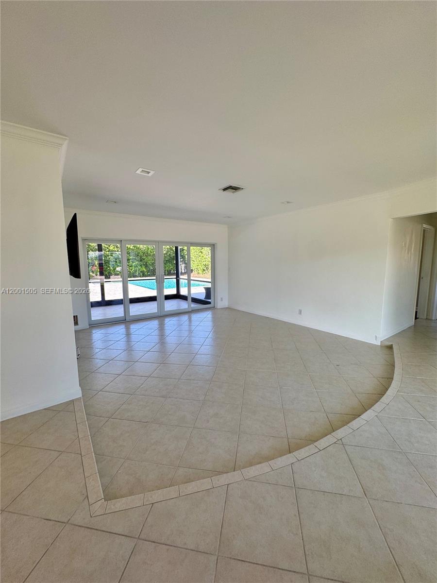 1093 Southwest 14th Street Boca Raton, FL 33486 - Photo 8 of 28 an empty room with floor to ceiling windows and outdoor view