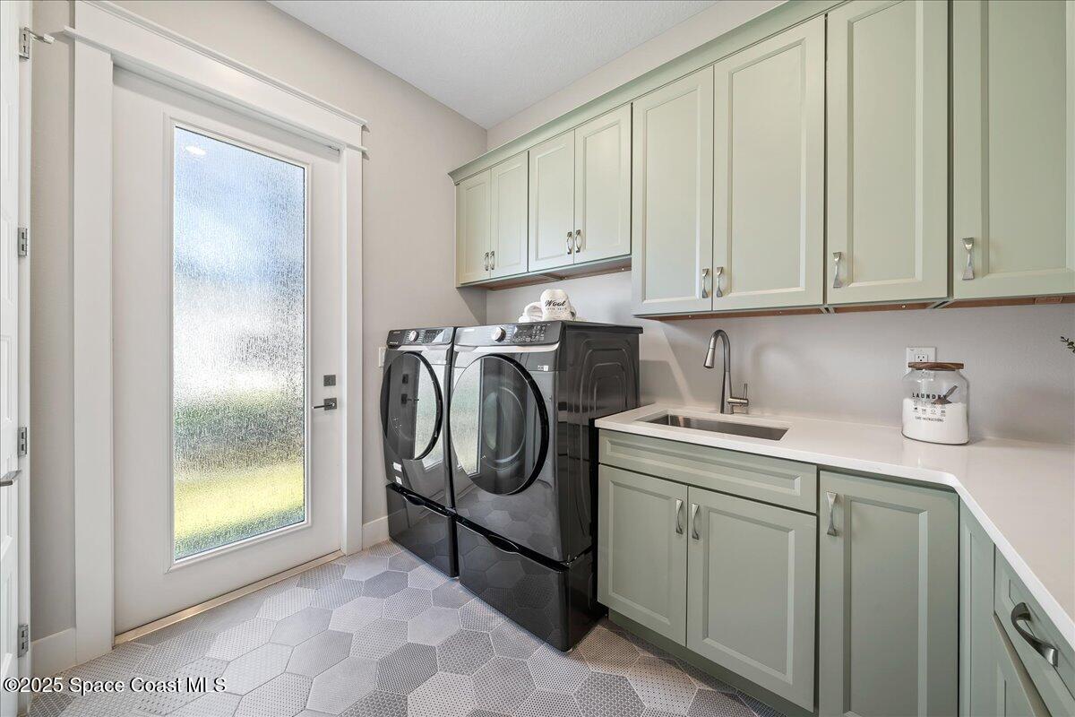 7953 Galikova Way Melbourne, FL 32940 - Photo 11 of 17 a utility room with dryer and washer