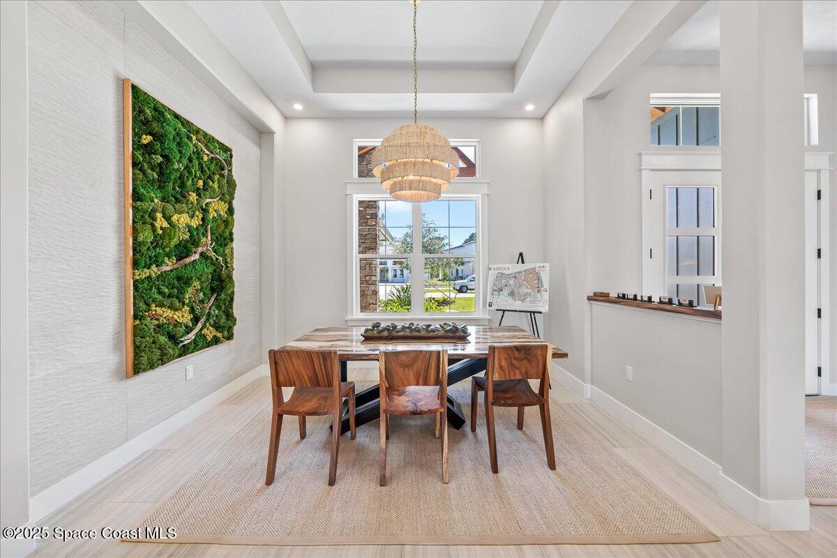 7953 Galikova Way Melbourne, FL 32940 - Photo 3 of 17 a view of a dining room with furniture window and outside view