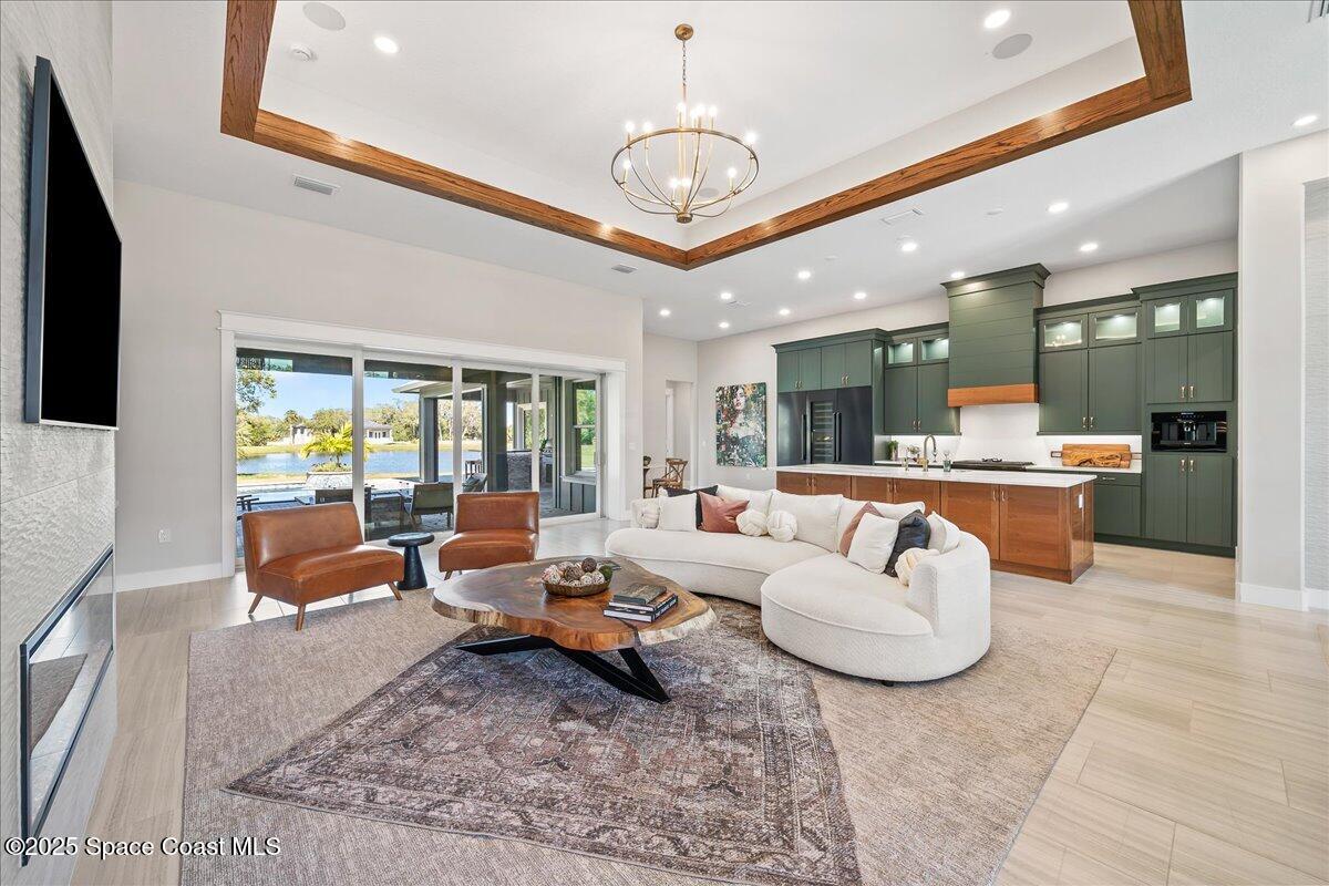 7953 Galikova Way Melbourne, FL 32940 - Photo 6 of 17 a living room with furniture and a large window