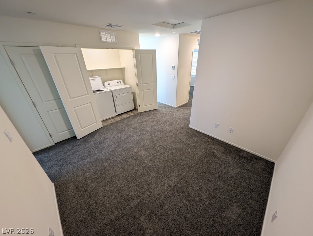 4820 Orchid Rdg Avenue Las Vegas, NV 89141 - Photo 16 of 27 Functional laundry area featuring a washer and dryer unit, integrated into the living space.