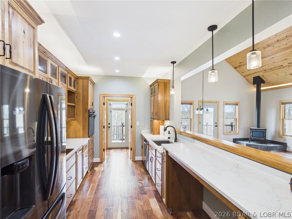 6055 McCasland Road Versailles, MO 65084 - Photo 41 of 99 Kitchen with breakfast bar, looking towards laundr
