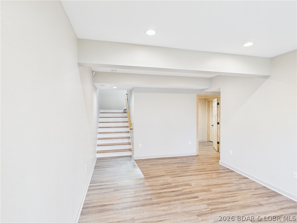 6055 McCasland Road Versailles, MO 65084 - Photo 54 of 99 Basement family room with stairs to main floor