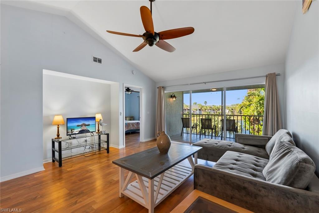 121 Gabriel Circle, Unit 1108 Naples, FL 34104 - Photo 12 of 41 a living room with furniture a ceiling fan and a window