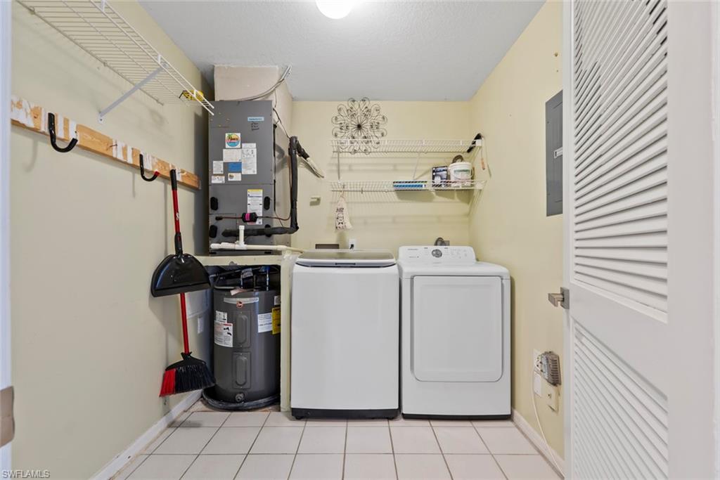 121 Gabriel Circle, Unit 1108 Naples, FL 34104 - Photo 26 of 41 a utility room with dryer and washer