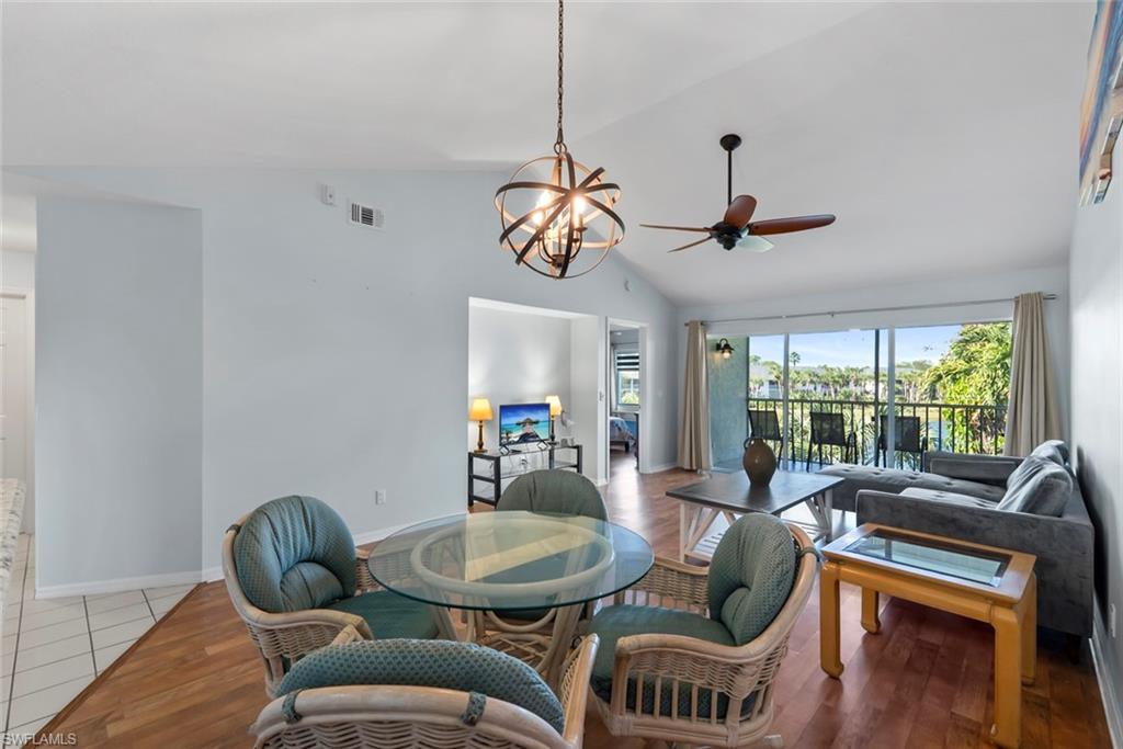 121 Gabriel Circle, Unit 1108 Naples, FL 34104 - Photo 3 of 41 a view of a dining room with furniture window and outside view