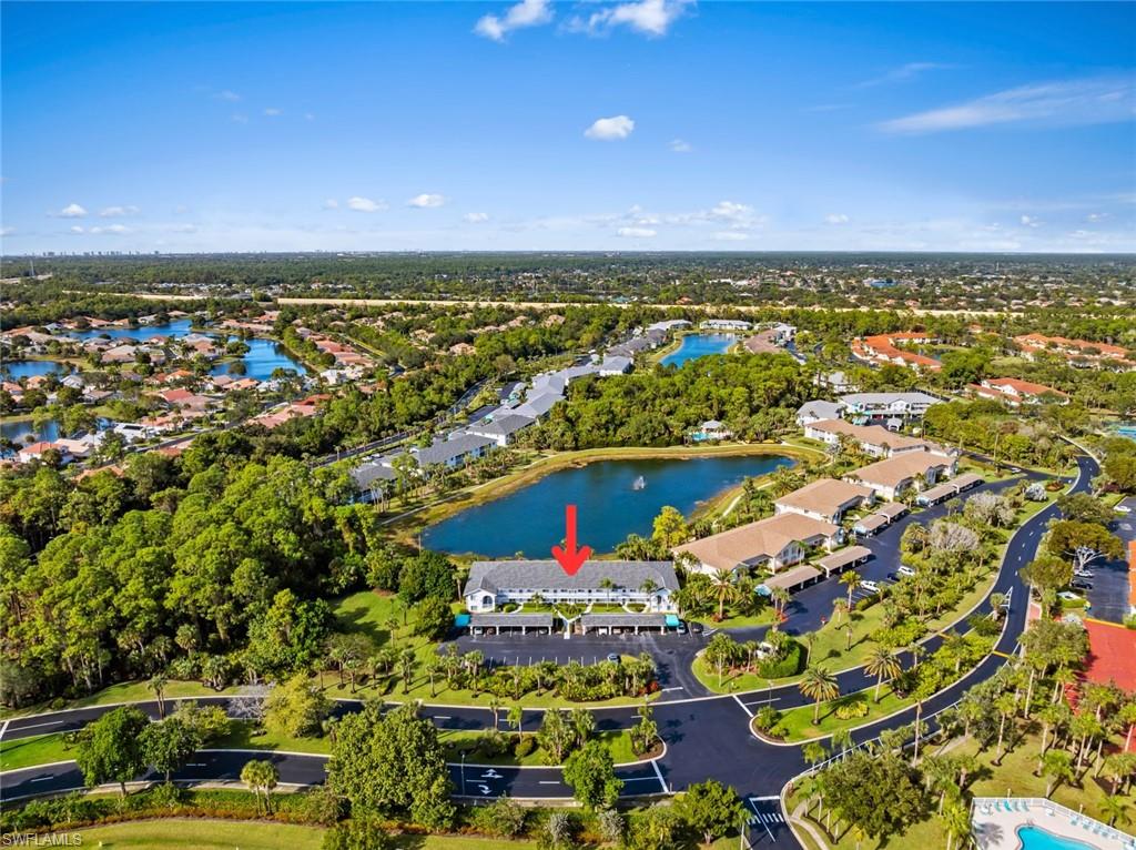 121 Gabriel Circle, Unit 1108 Naples, FL 34104 - Photo 34 of 41 an aerial view of residential houses with outdoor space and swimming pool