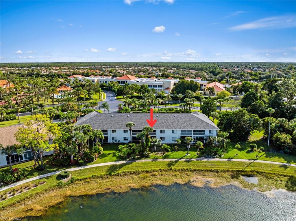 121 Gabriel Circle, Unit 1108 Naples, FL 34104 - Photo 38 of 41 an aerial view of residential houses with outdoor space and trees