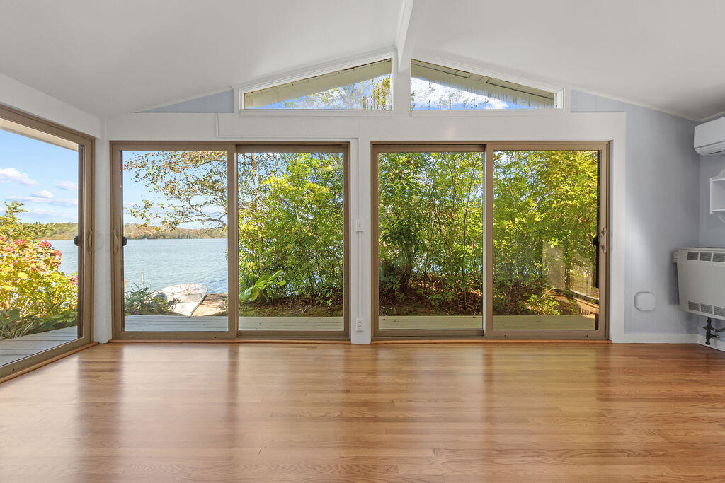 35 Santuit Lane Mashpee, MA 02649 - Photo 11 of 51 a view of an empty room with wooden floor and a window
