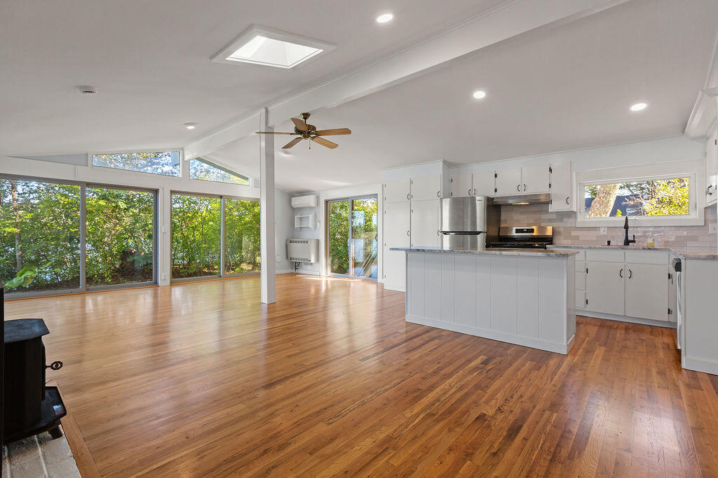 35 Santuit Lane Mashpee, MA 02649 - Photo 12 of 51 a view of a kitchen with microwave and wooden floor
