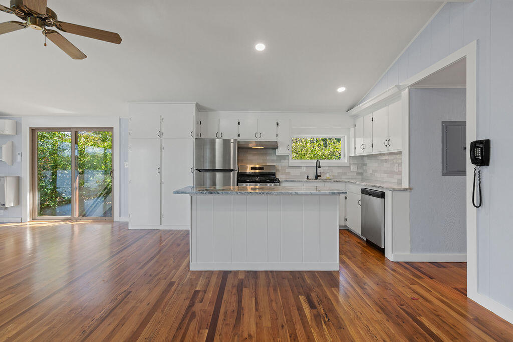 35 Santuit Lane Mashpee, MA 02649 - Photo 16 of 51 a kitchen with stainless steel appliances a refrigerator sink and cabinets