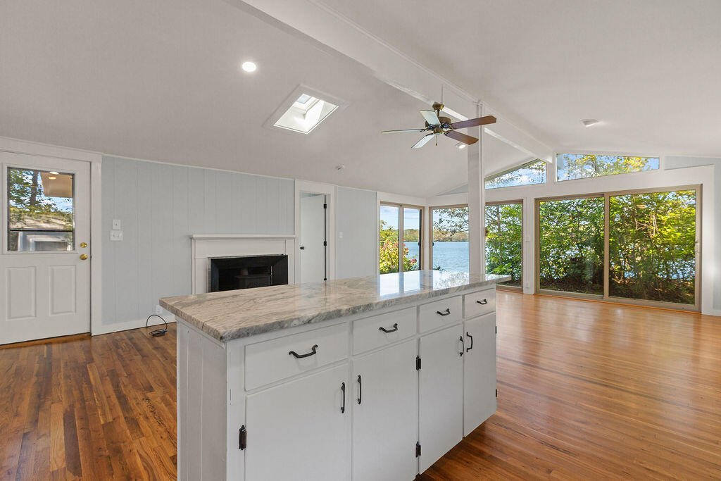 35 Santuit Lane Mashpee, MA 02649 - Photo 17 of 51 a view of cabinets wooden floor and a ceiling fan in a room