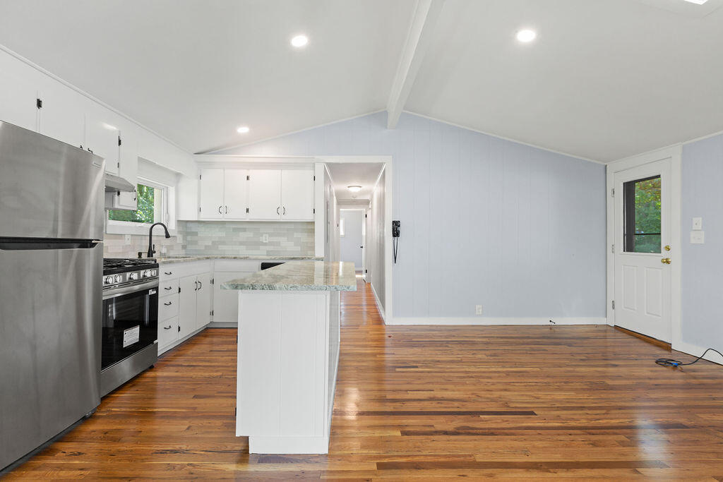 35 Santuit Lane Mashpee, MA 02649 - Photo 19 of 51 a kitchen with a refrigerator and a stove top oven
