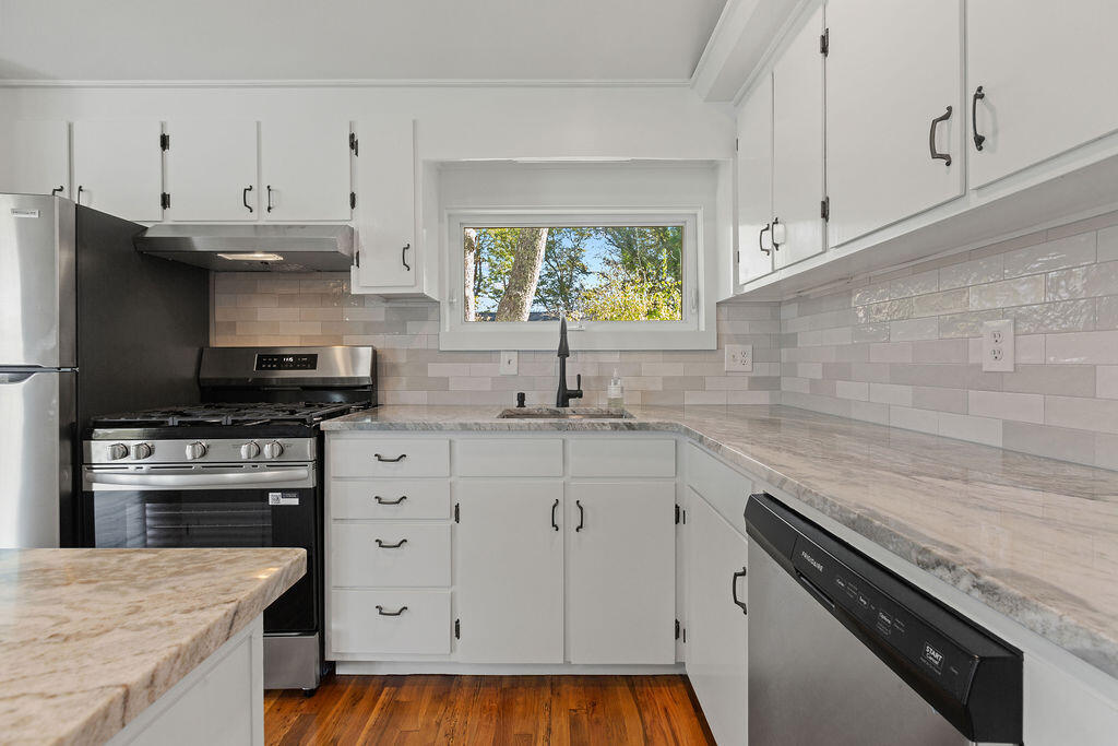 35 Santuit Lane Mashpee, MA 02649 - Photo 23 of 51 a kitchen with granite countertop a sink stainless steel appliances and cabinets