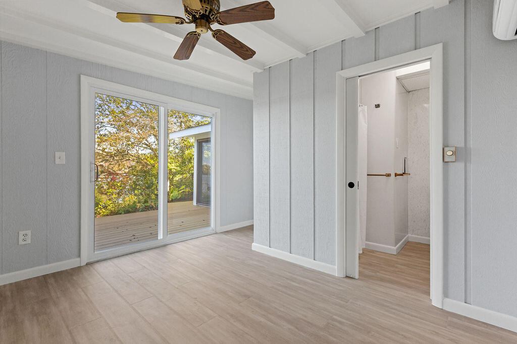 35 Santuit Lane Mashpee, MA 02649 - Photo 31 of 51 a view of an empty room with wooden floor and a window