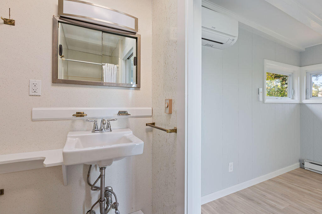 35 Santuit Lane Mashpee, MA 02649 - Photo 33 of 51 a bathroom with a sink a mirror and a window