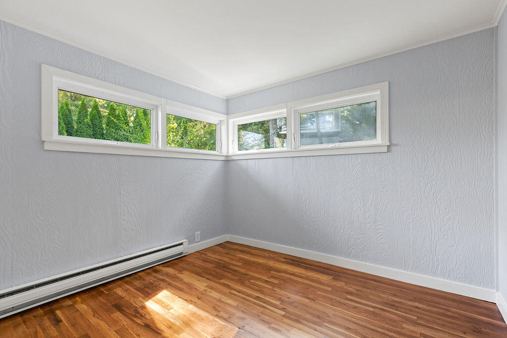 35 Santuit Lane Mashpee, MA 02649 - Photo 37 of 51 a view of an empty room with wooden floor and a window