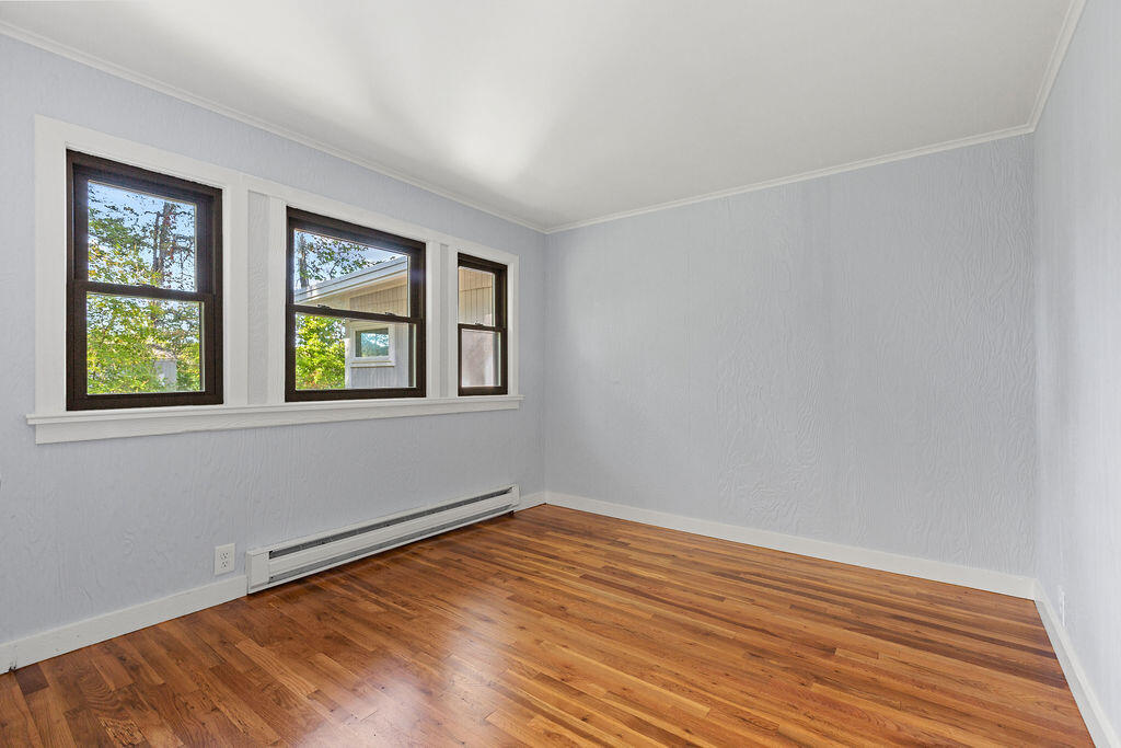 35 Santuit Lane Mashpee, MA 02649 - Photo 39 of 51 a view of an empty room with window and wooden floor