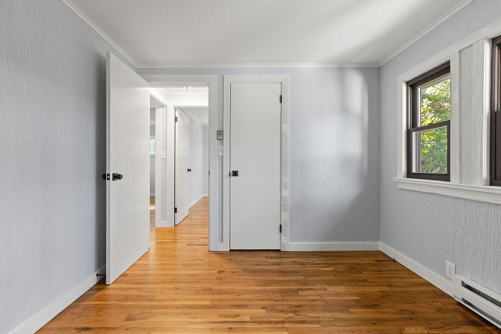 35 Santuit Lane Mashpee, MA 02649 - Photo 40 of 51 a view of hallway with window and wooden floor