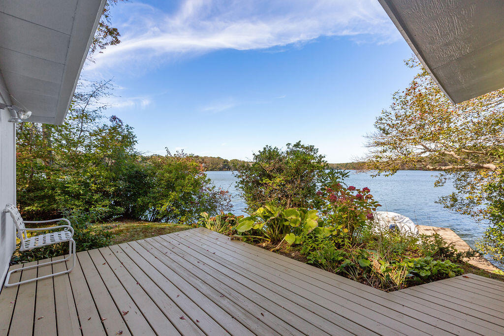 35 Santuit Lane Mashpee, MA 02649 - Photo 4 of 51 a view of balcony with wooden floor and fence